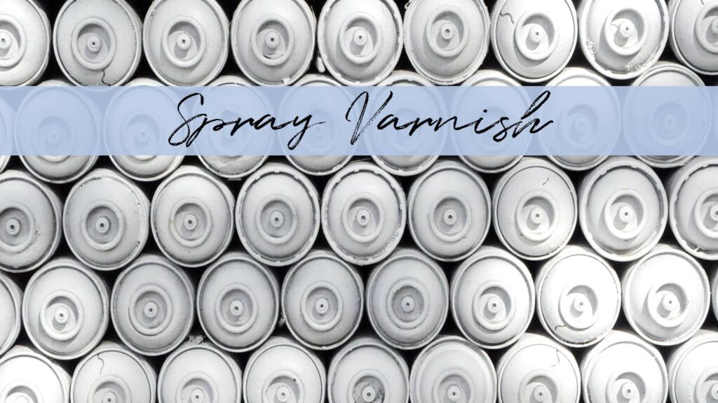 Stacked white spray cans to represent spray varnish.