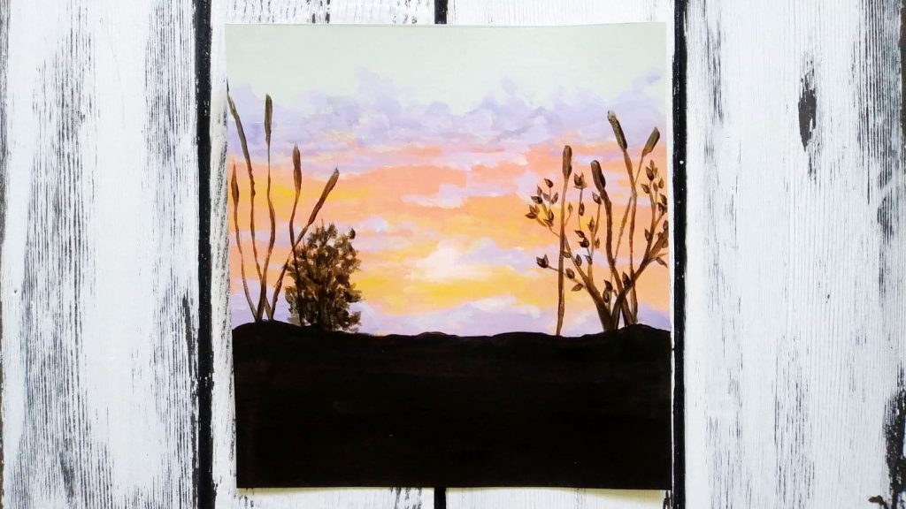 Step number six is adding in some grasses and bushes to push the sunset back further.