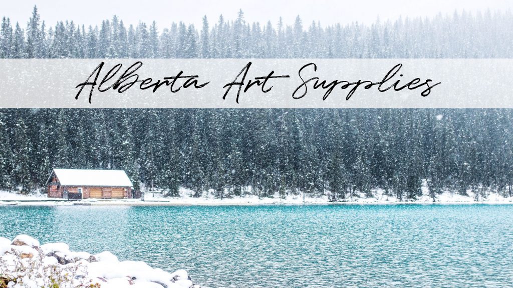 Snow falling on a bright blue lake, with a cabin and forest in the background, at Lake Louise in Banff, Alberta. Titled "Alberta Art Supplies".