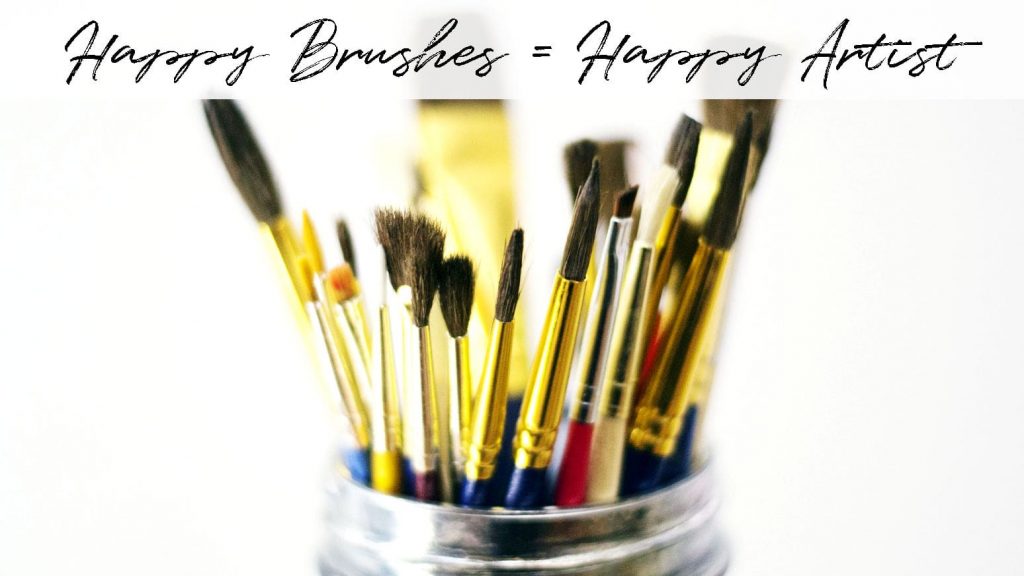 A mason jar filled with assorted paint brushes.
