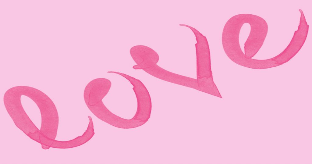 The word "love" painted on a pink background using a round brush.