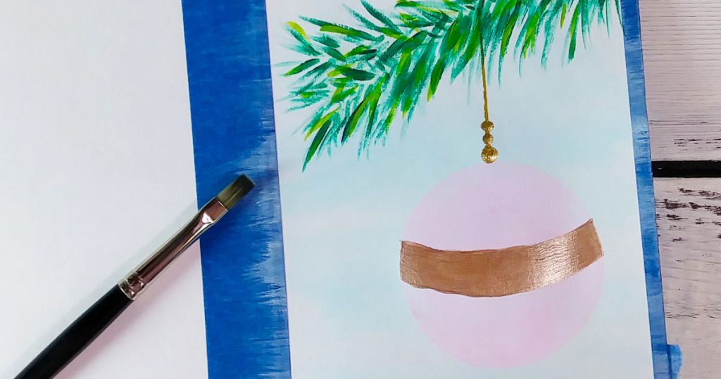 A metallic brown stripe going from one side of the pink ornament to the other