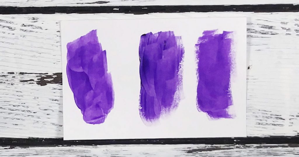 A paint swatch showing three different brands of purple paint that are substitute acrylic paint colors for each other