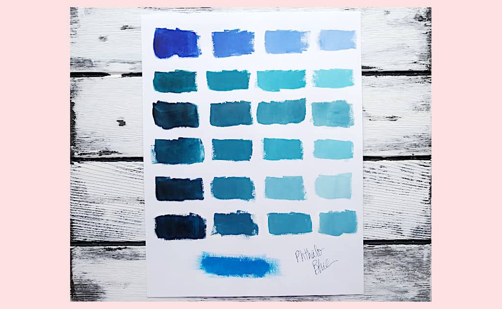 A grid of color swatches made from mixing Phthalo Blue with other pigments and then lightened to better see the undertone of the navy blue that was originally created.
