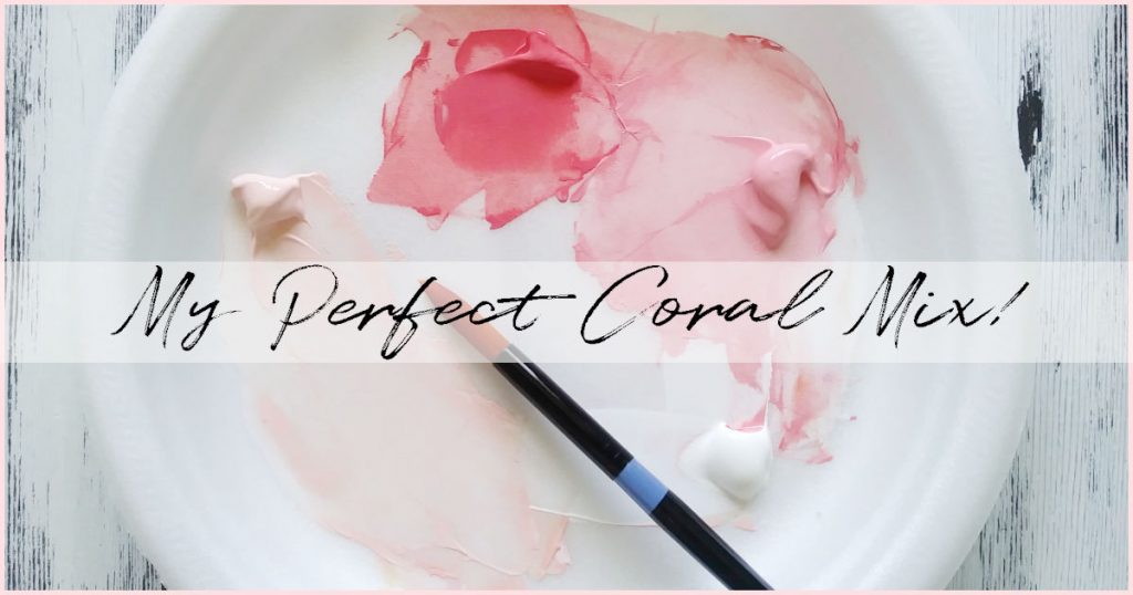 A white palette with four pink coral custom paint colors and a round paintbrush laying on top.