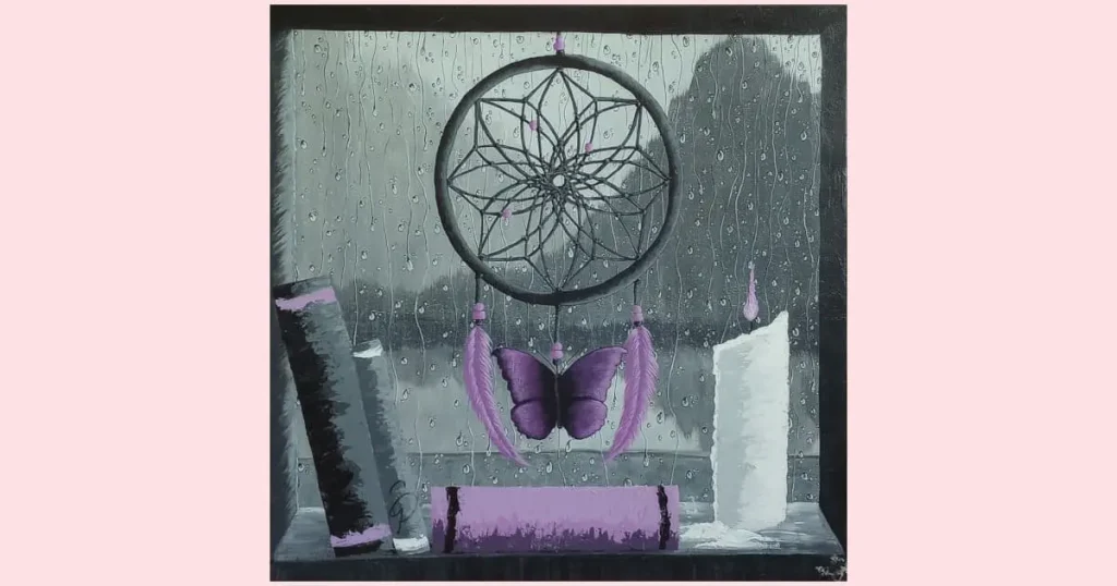 A black, white, and purple painting of a dreamcatcher, books, and a lit candle sitting on a window ledge with a view of mountains and a lake as seen through the rain splattered window. Original painting by Sara Dorey.