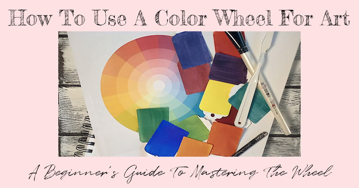 A color wheel, paint chips, and painting tools on a white-washed wooden background