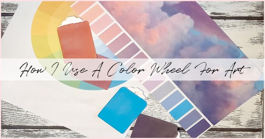 A color wheel, an image of blue, purple, and pink clouds, and various color chips that represent colors in the image, sit atop a white-washed background as a visual example of how I personally use a color wheel for art.